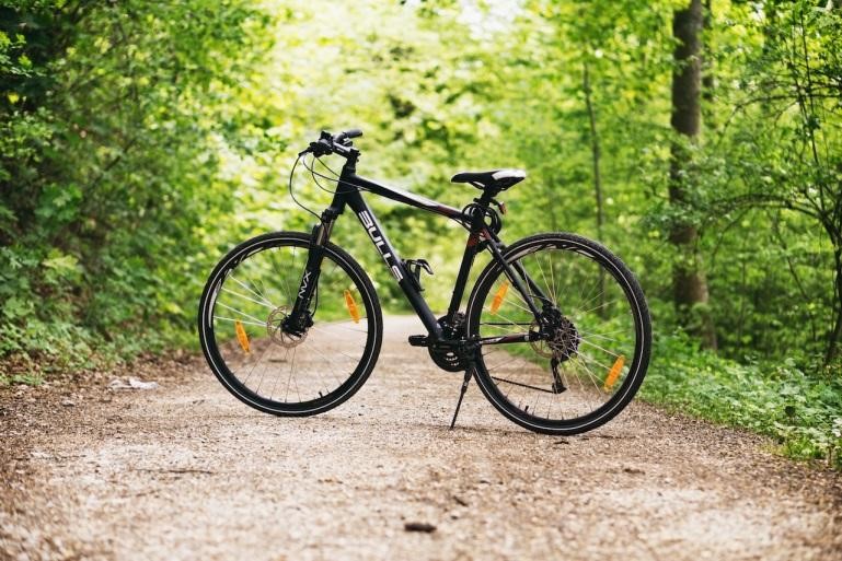 A black trail bike in the woods