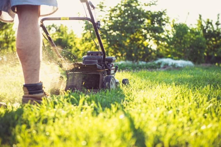 A man mowing a lawn