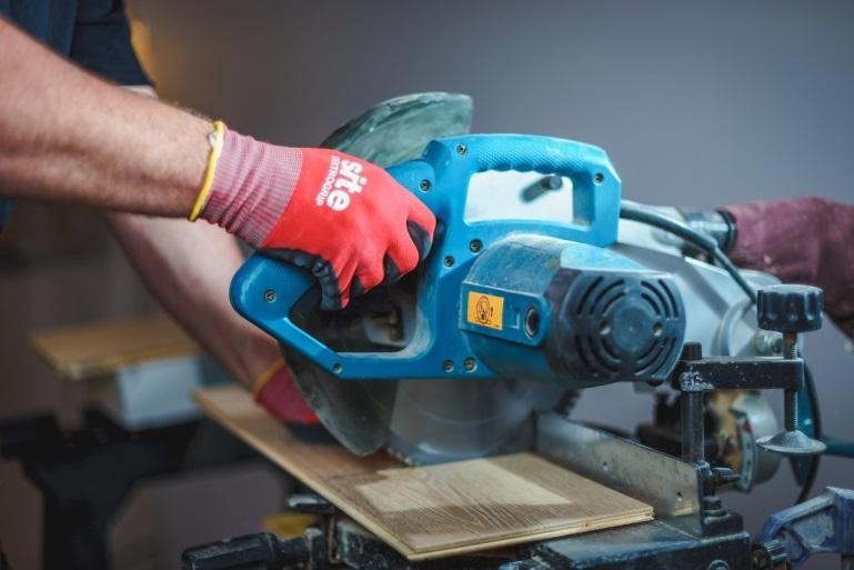 A person using a power saw