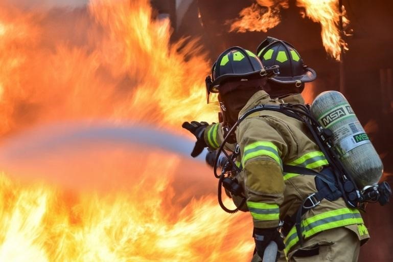 Firefighters quelling a raging fire