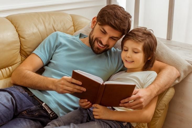 A father reading to his son