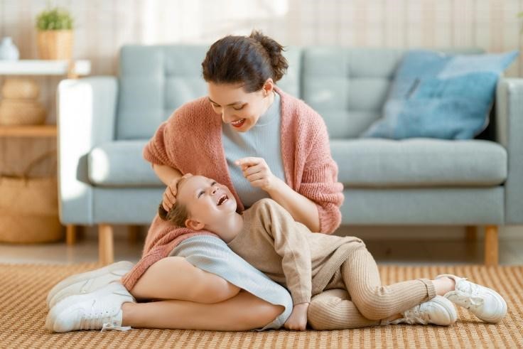 A mother playing with her daughter